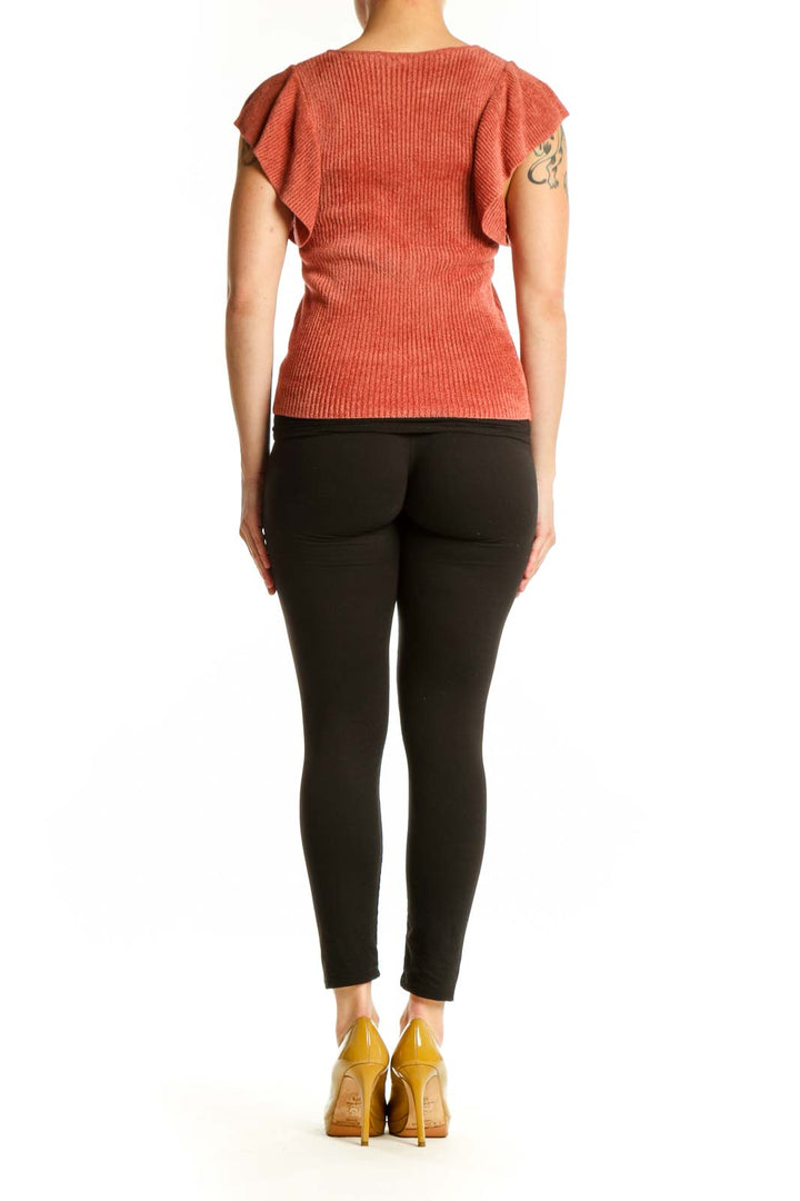 Rust orange ribbed ruffle cap sleeve top, back view showing fitted silhouette