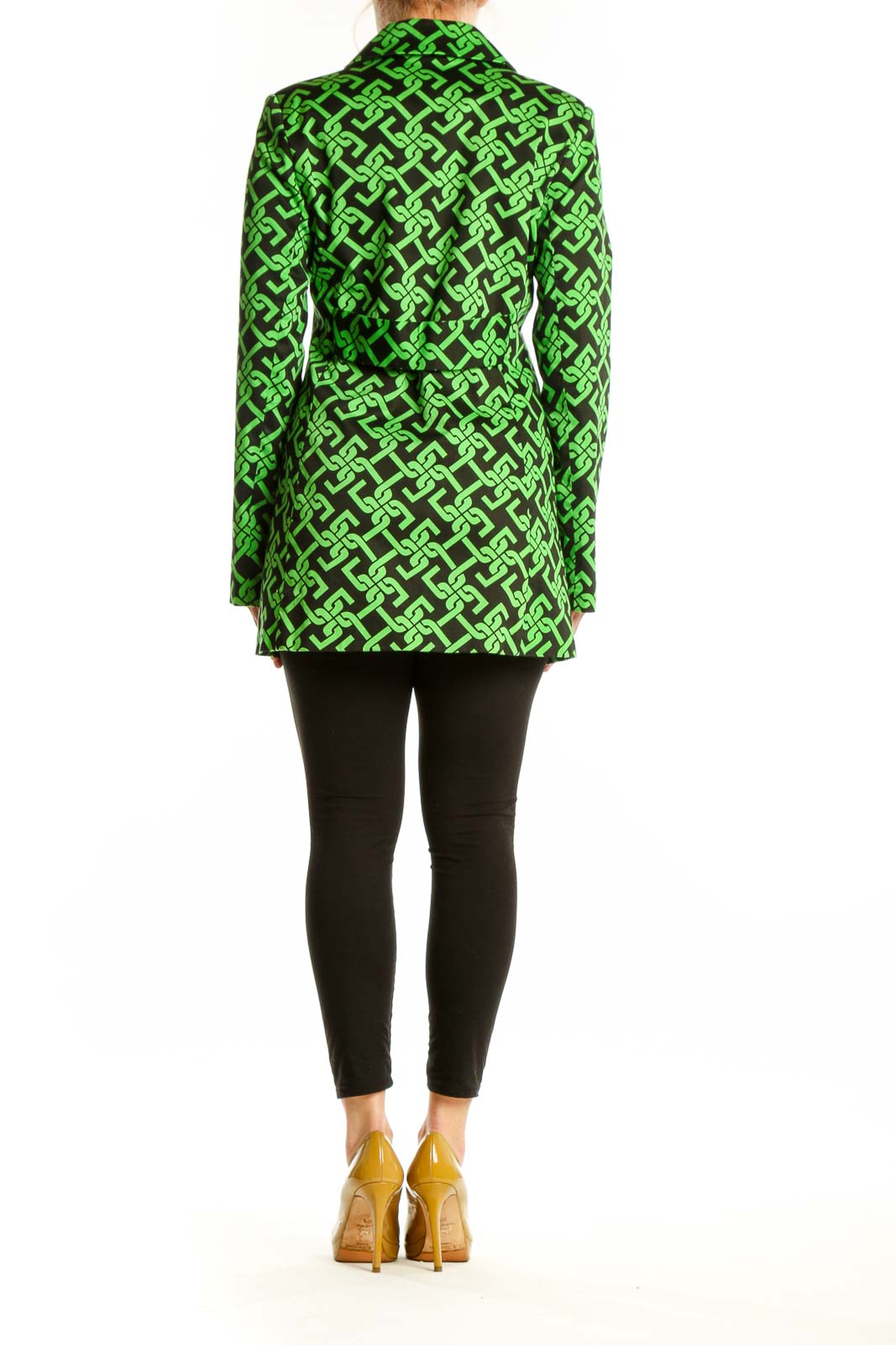 Back view of green geometric patterned jacket by Skirtin Around showing the full length and drape of the tailored design