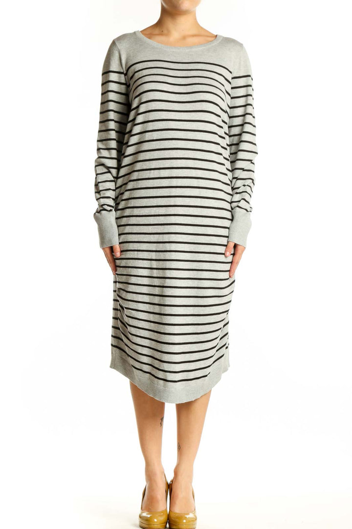 Front view of gray and navy striped long sleeve knit dress with crew neckline and midi length