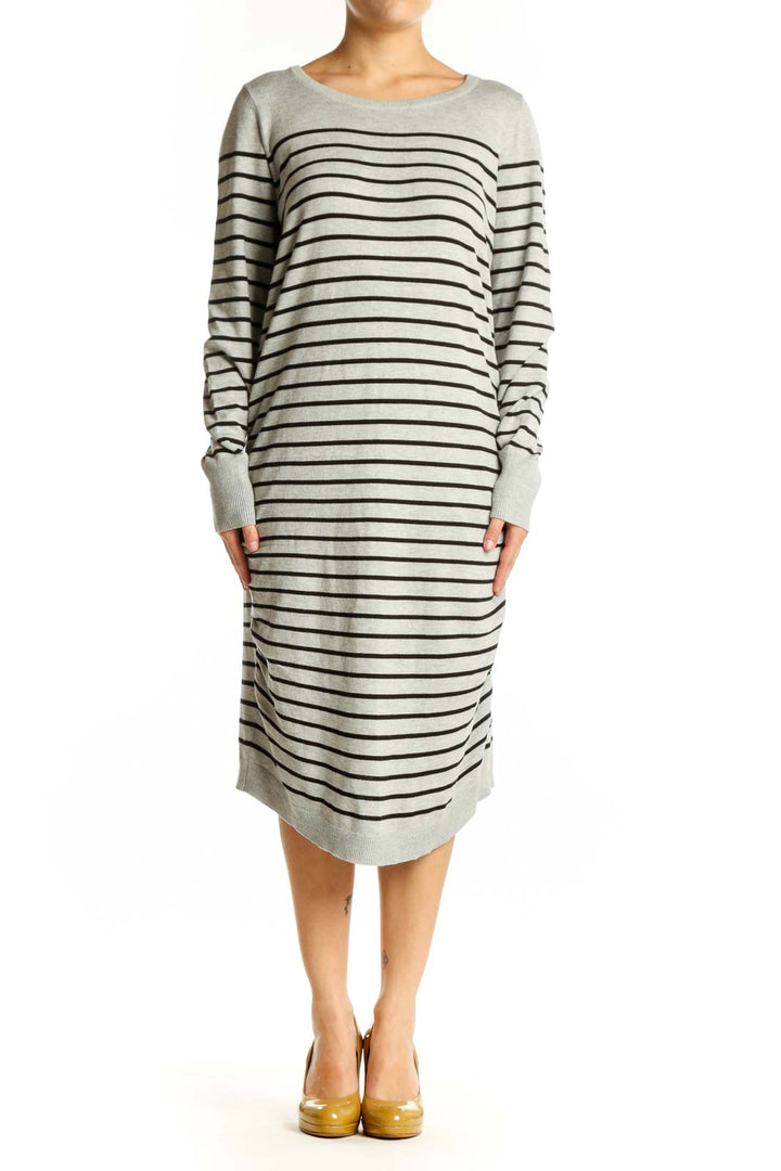 Front view of gray and navy striped long sleeve knit dress with crew neckline and midi length