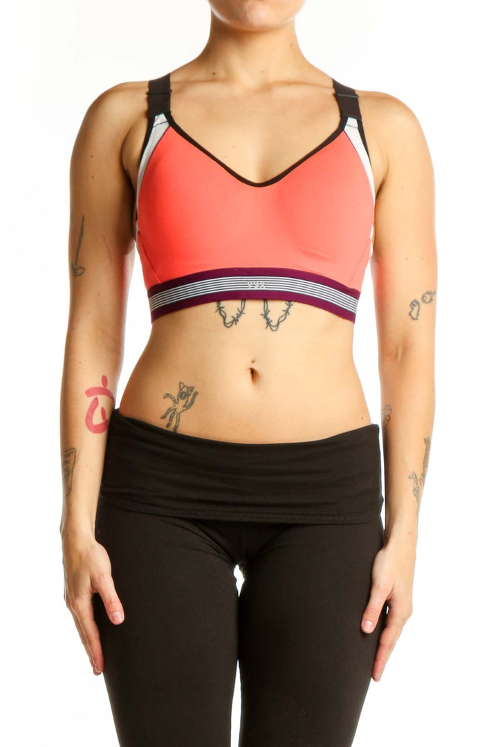 Coral VSX Sport sports bra with black straps and white piping, front view on model