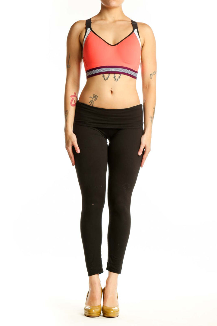 Coral VSX Sport sports bra with black straps and white piping, front view on model