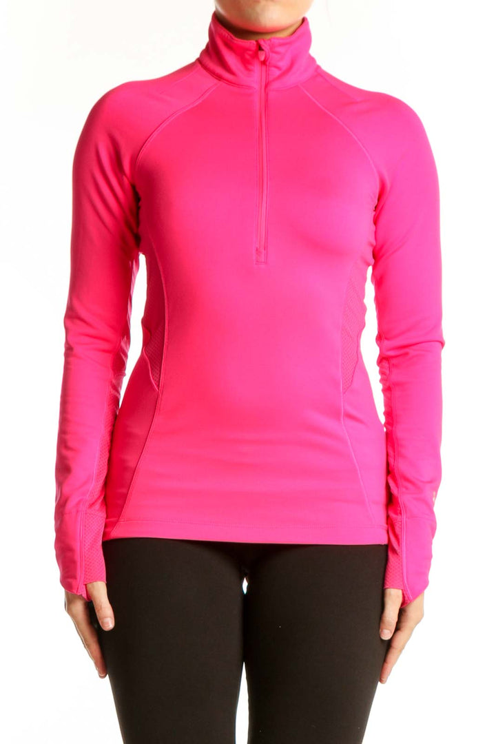 Pink half-zip athletic long sleeve top front view on model