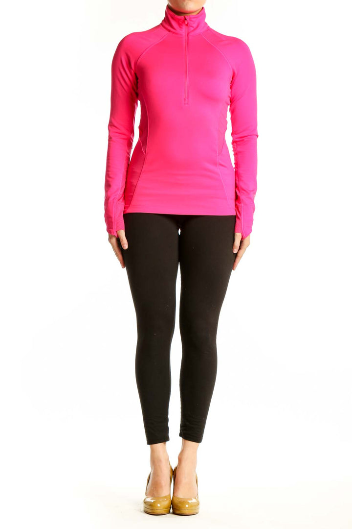 Pink half-zip athletic long sleeve top front view on model