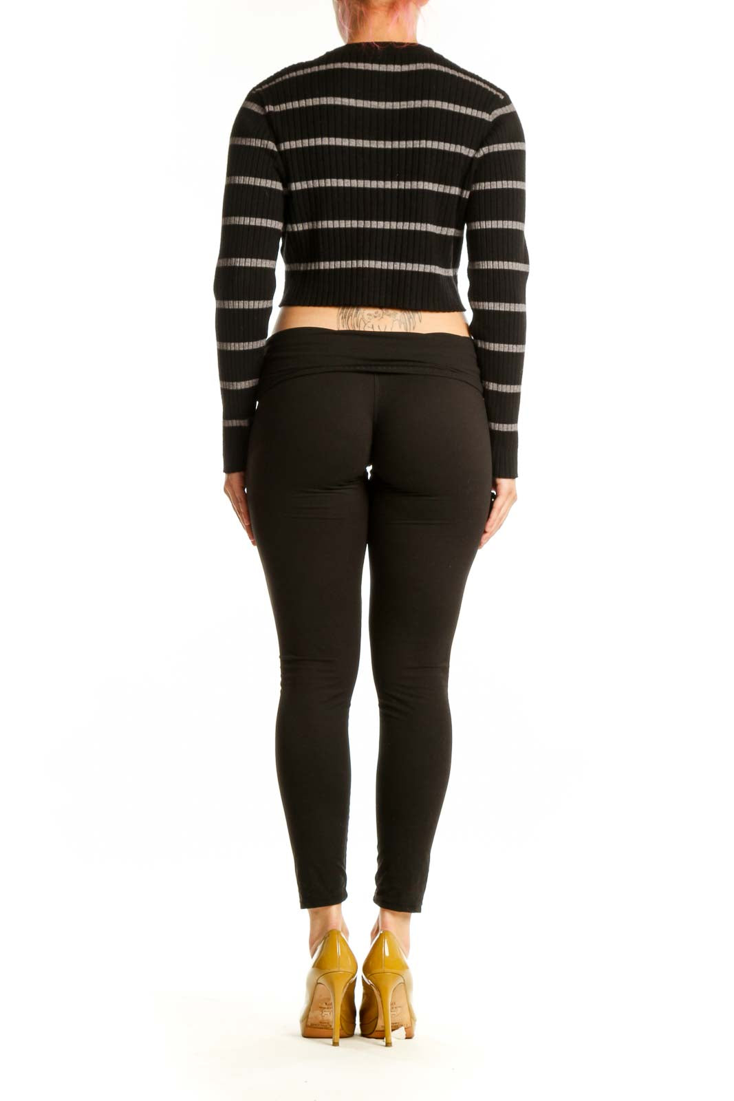 Back view of black striped crop cardigan showing horizontal stripe pattern and fitted silhouette