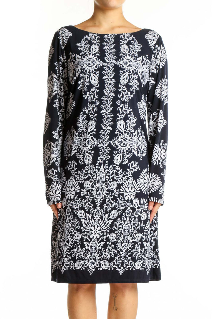 Black damask floral long sleeve dress with white ornate print, front view