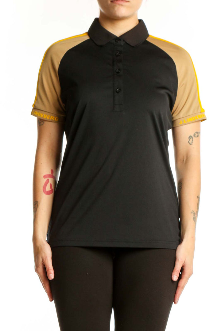 J. Lindeberg black and gold colorblock polo shirt front view, size L with collared neckline and button closure