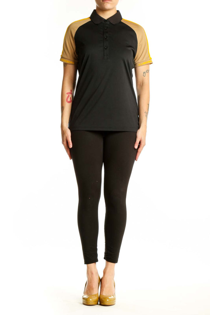 J. Lindeberg black and gold colorblock polo shirt front view, size L with collared neckline and button closure