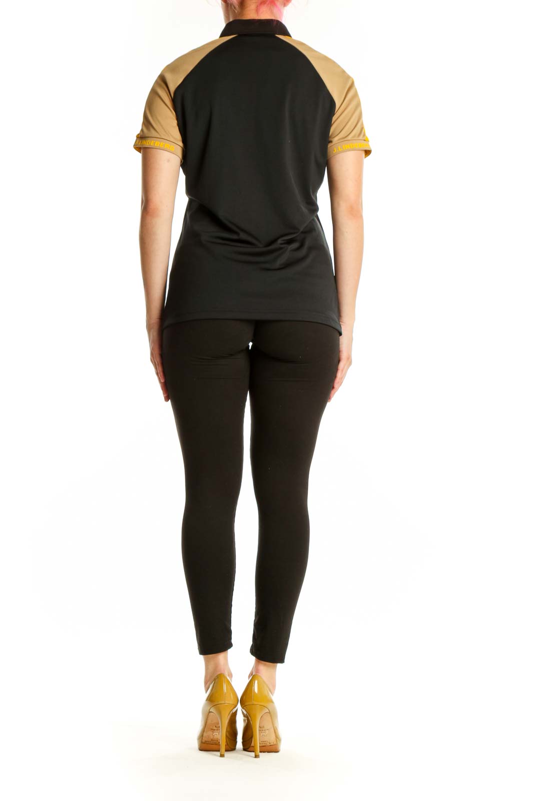 J. Lindeberg black and gold colorblock polo shirt back view, showing raglan sleeve design and tailored fit