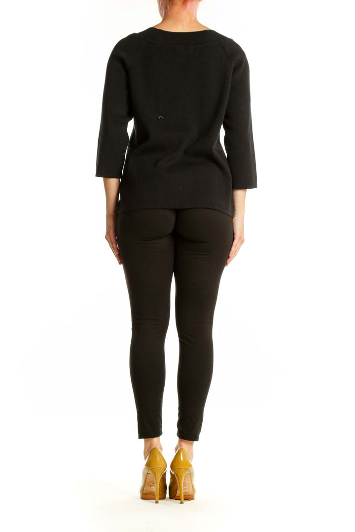 Black cotton top with keyhole neckline detail and 3/4 sleeves, back view