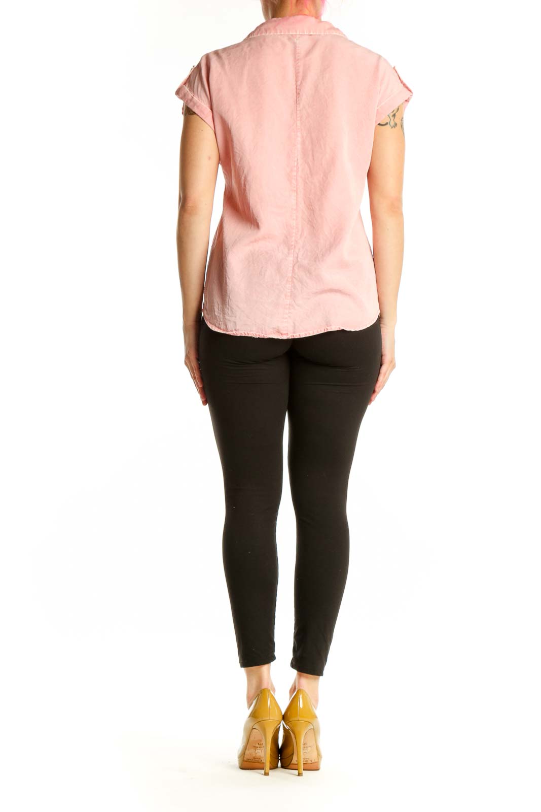 Back view of pink short-sleeve button-up shirt showing relaxed fit and rolled sleeves