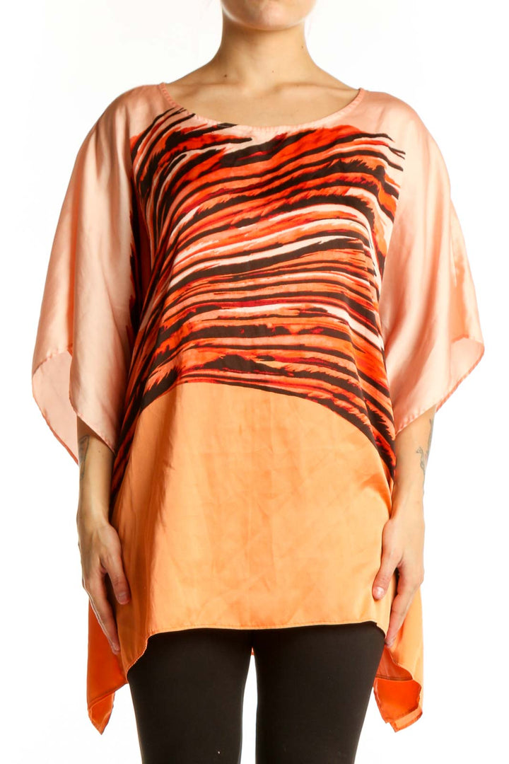 Orange and black striped Dana Buchman caftan top with asymmetrical flowing sleeves, front view on model