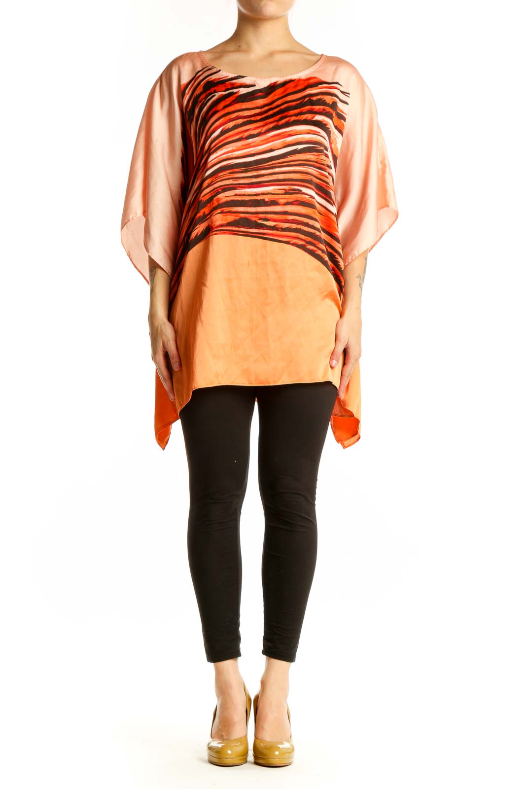 Orange and black striped Dana Buchman caftan top with asymmetrical flowing sleeves, front view on model