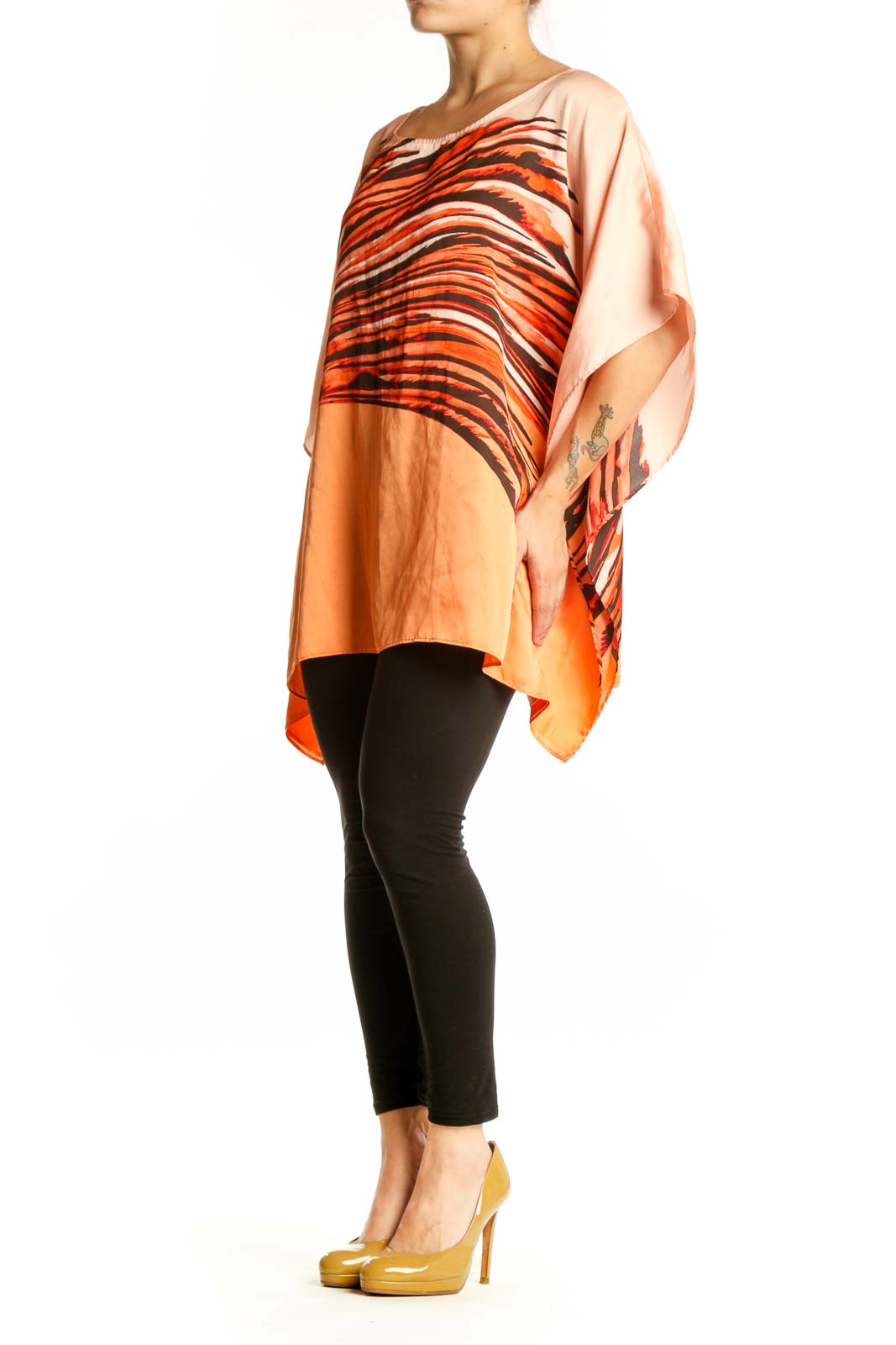 Orange and black striped Dana Buchman caftan top with asymmetrical flowing sleeves, front view on model