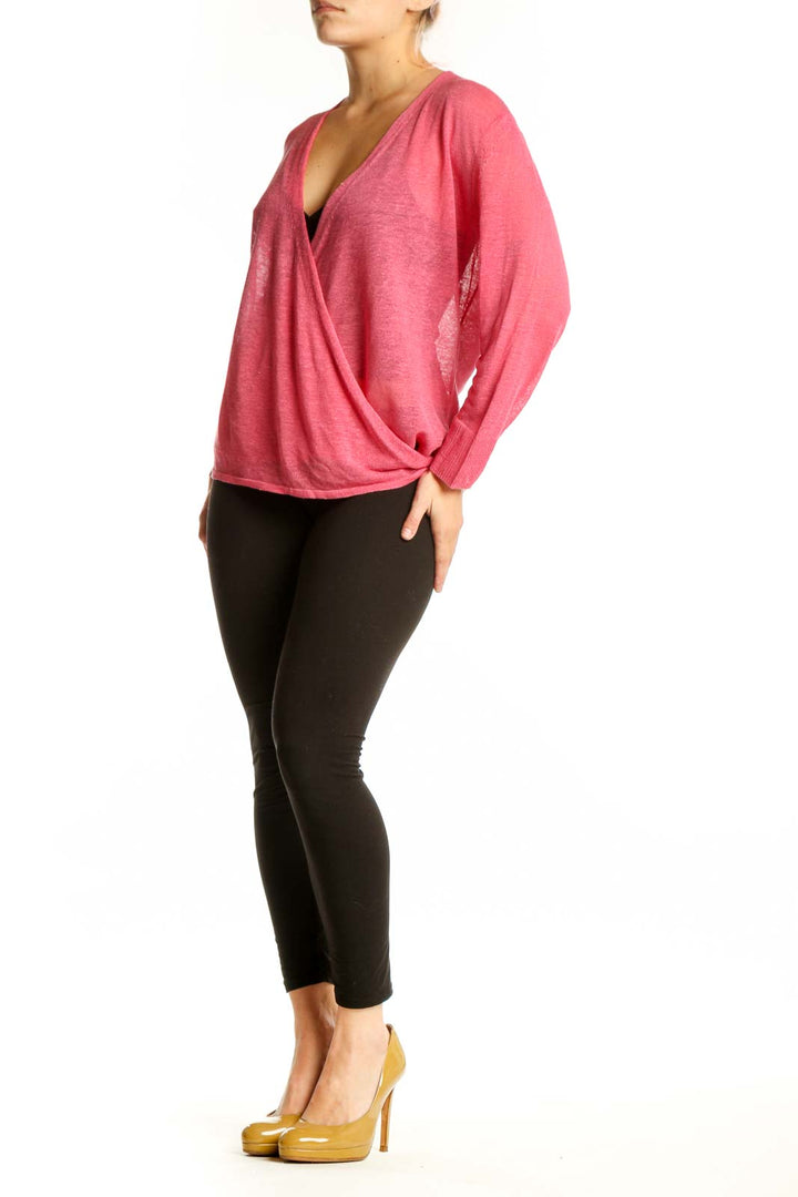 Pink linen viscose wrap top with V-neckline and long sleeves, front view