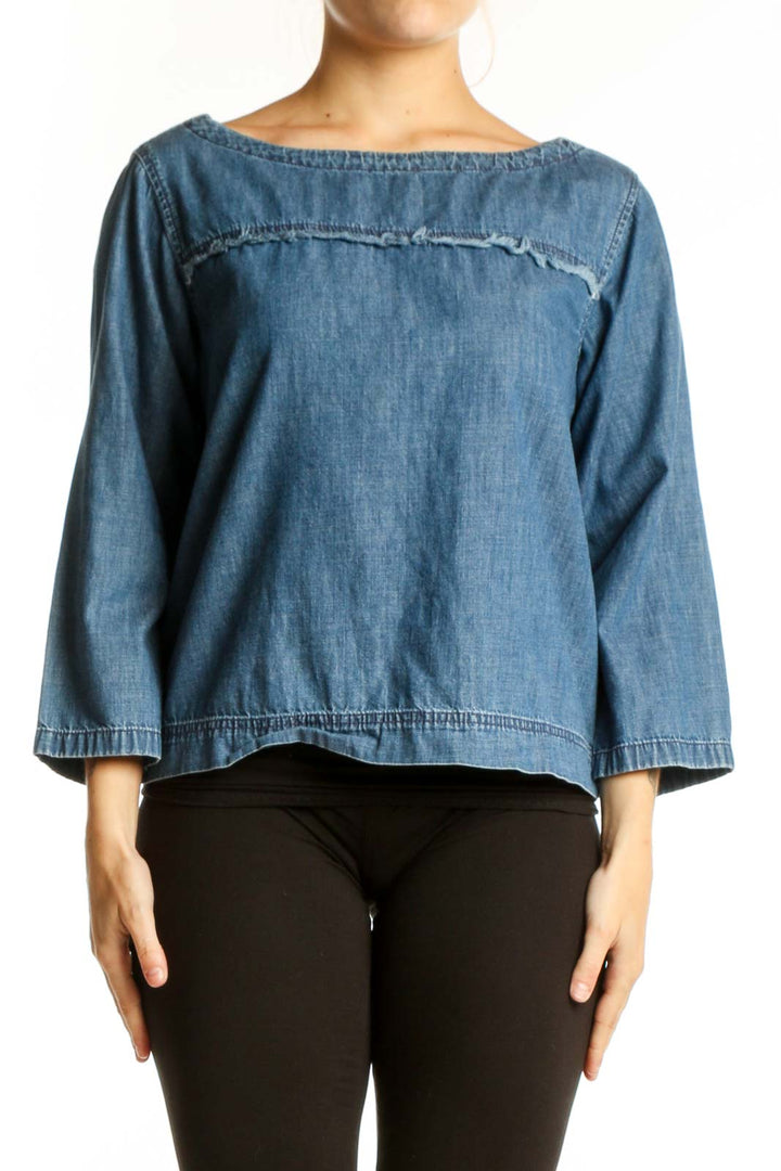 Blue denim cropped top with boat neckline and three-quarter sleeves, front view