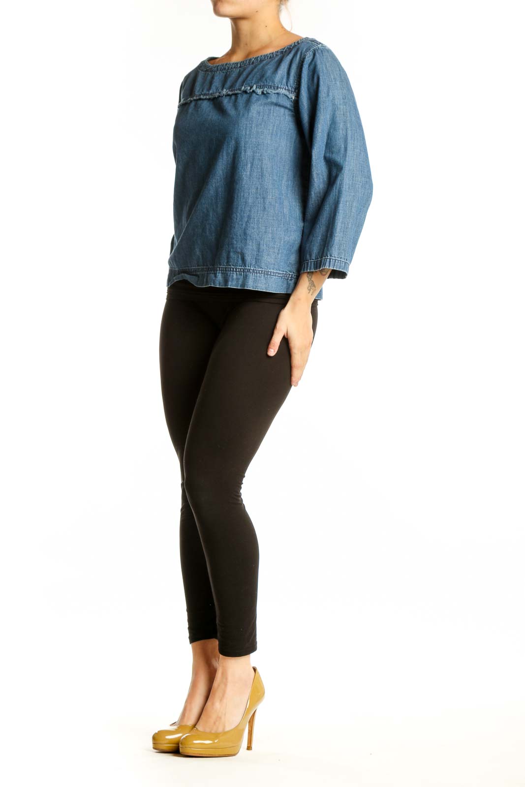 Blue denim cropped top with boat neckline and three-quarter sleeves, front view