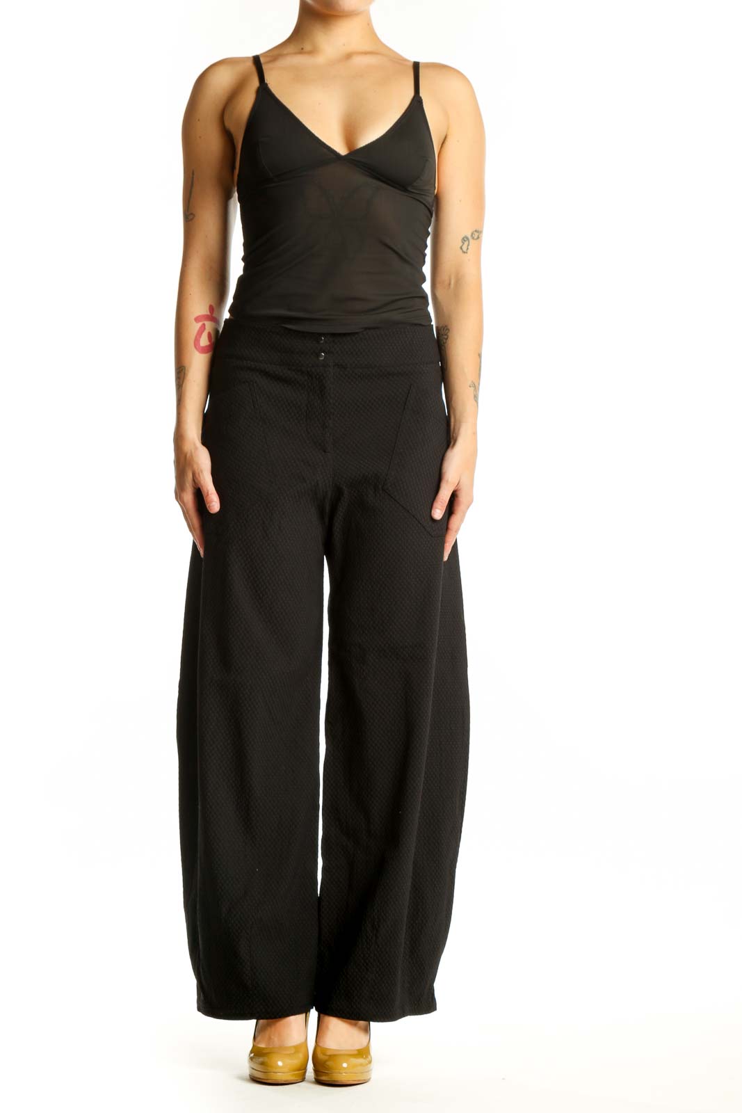 Black wide-leg textured pants with high-waisted design, front view on model