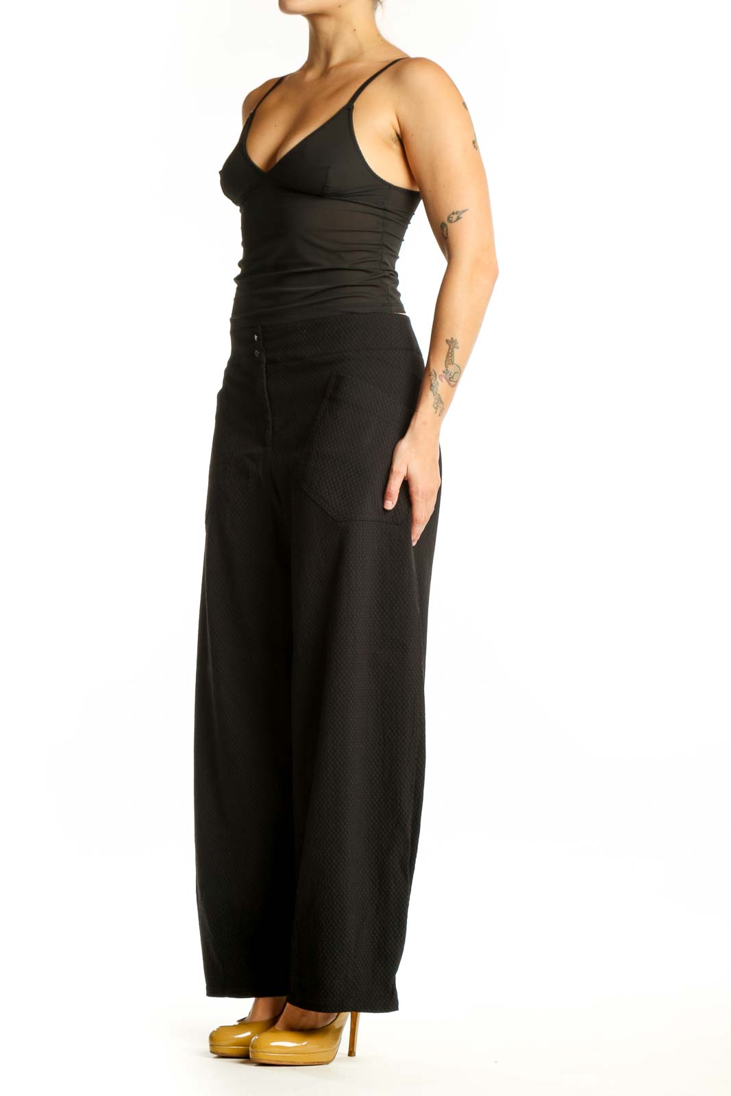 Black wide-leg textured pants with high-waisted design, front view on model