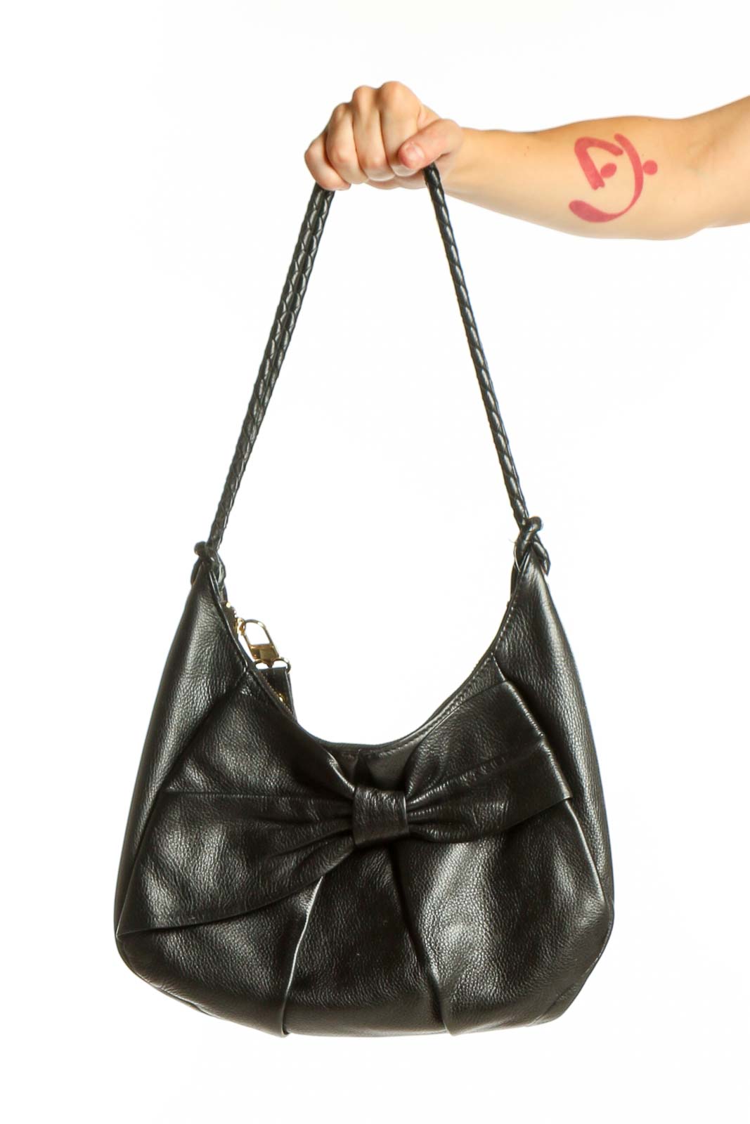 Black leather shoulder bag with bow detail and braided straps by Elliott Lucca