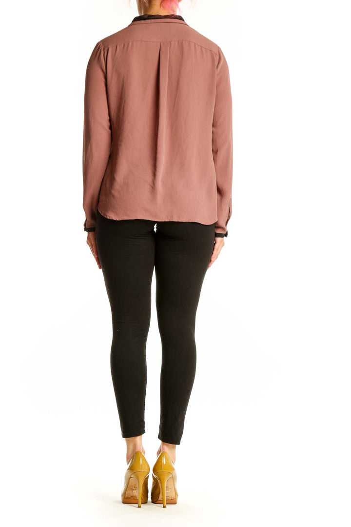 Mauve tie neck button-up blouse with black contrast trim, back view showing tie detail