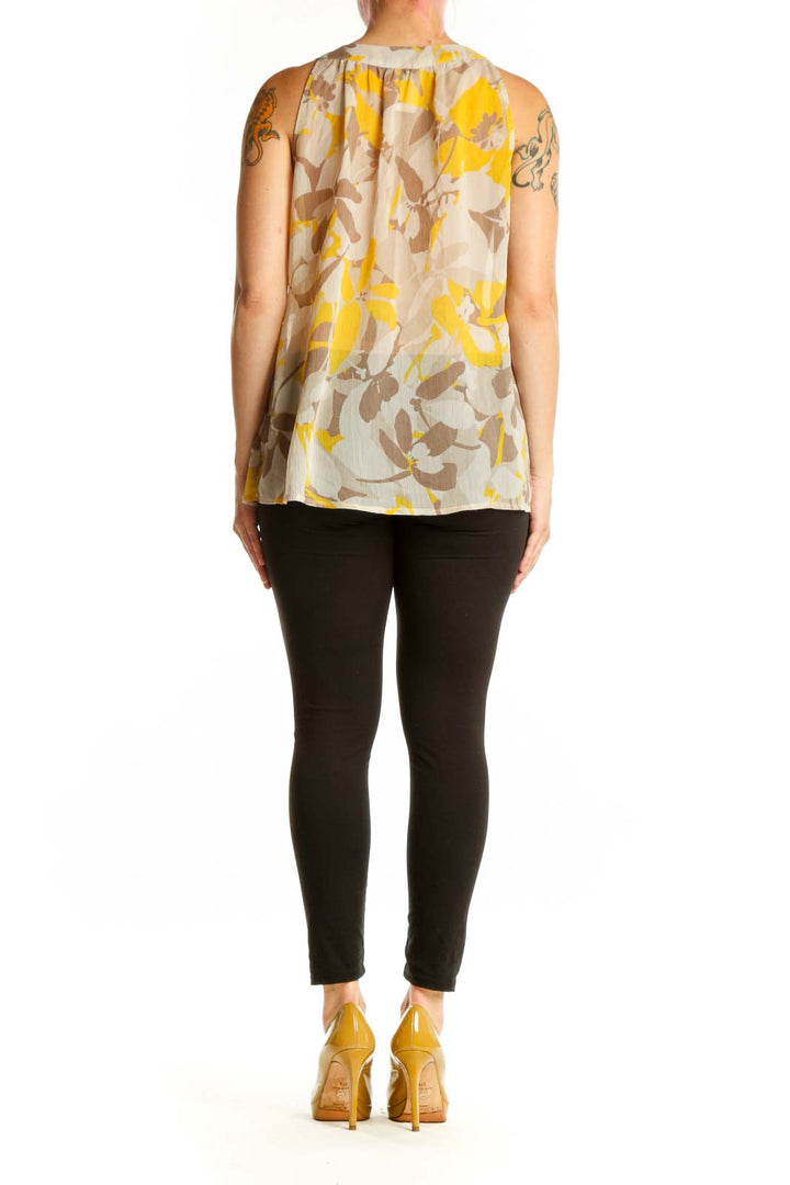 Back view of Gap yellow floral sleeveless top showing elasticized waist and relaxed fit