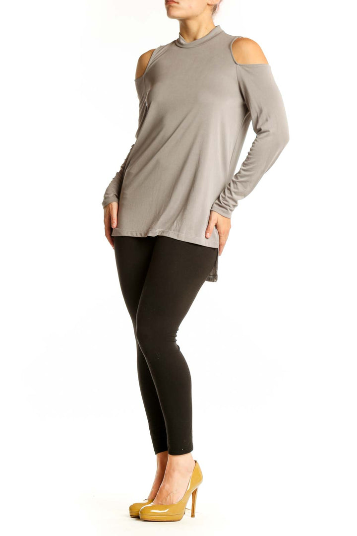 Beige cold shoulder long sleeve top with crew neckline, front view on model