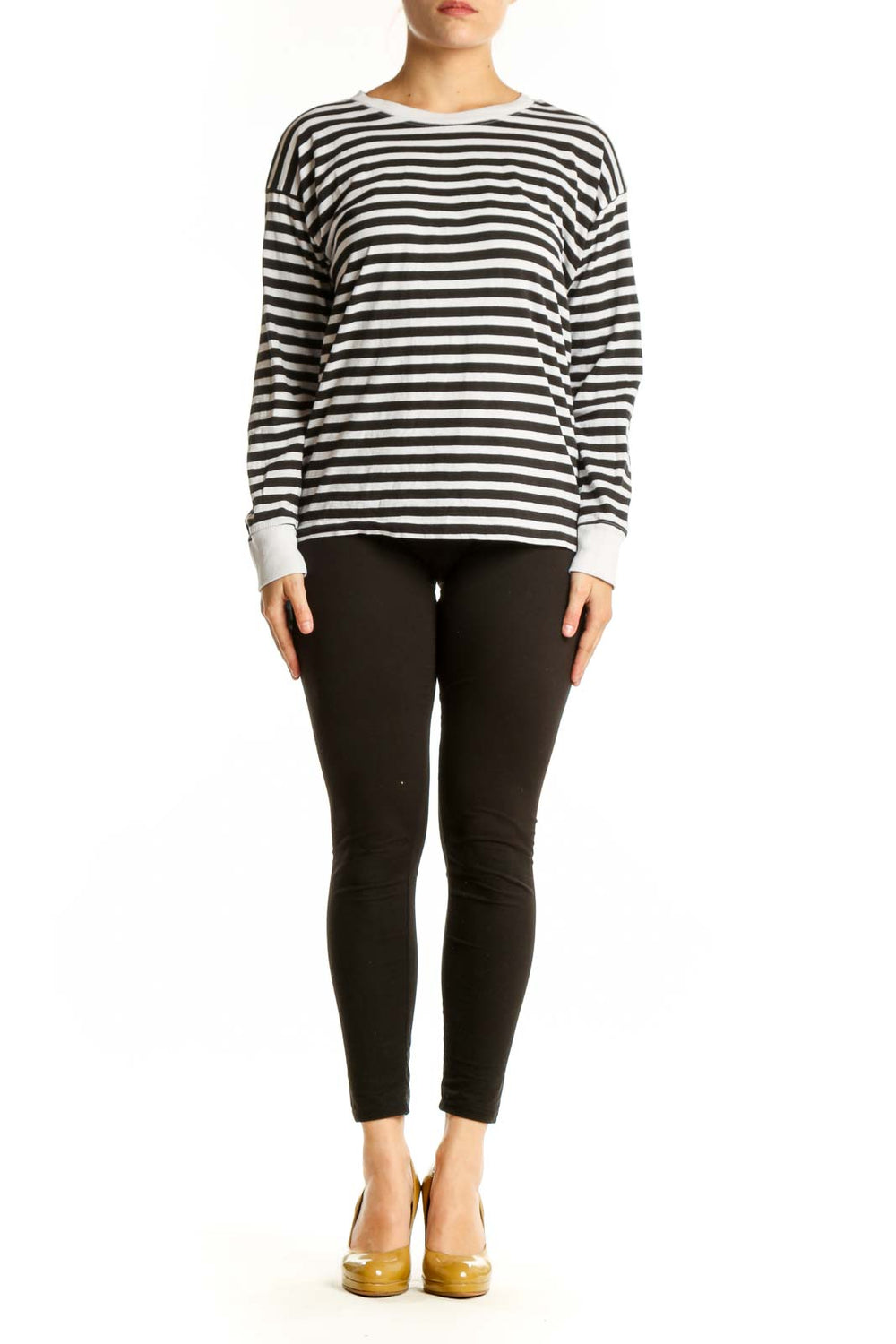 Front view of black and white striped long sleeve cotton top with crew neckline and white ribbed cuffs