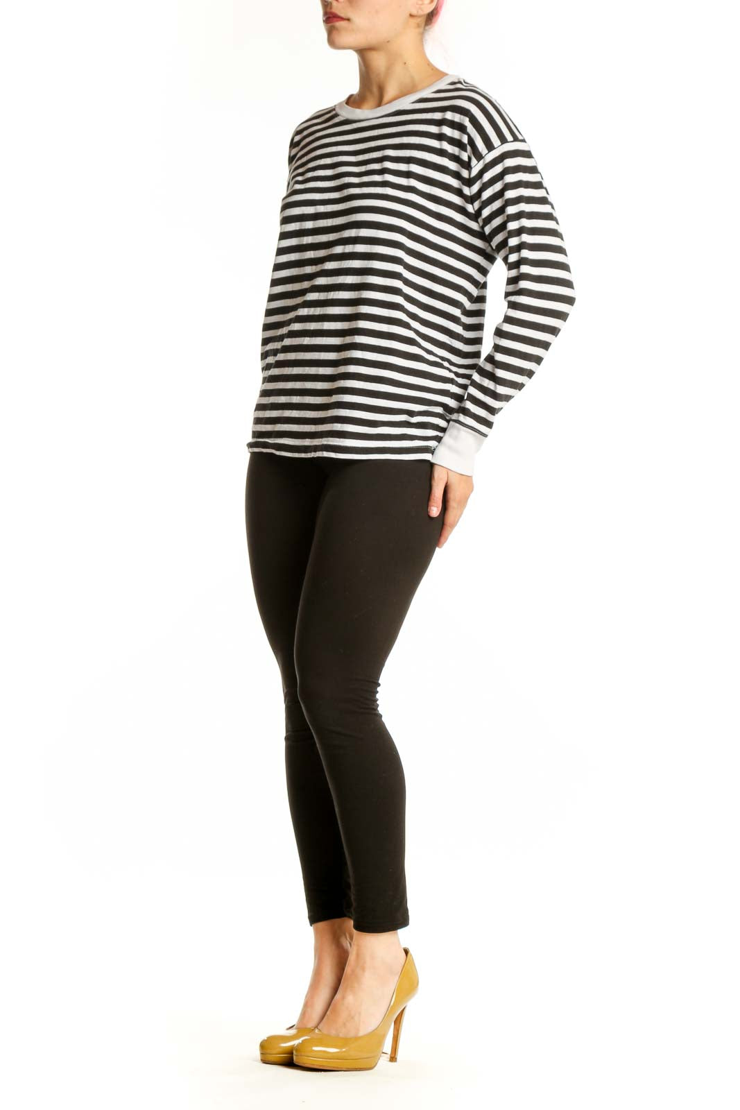 Front view of black and white striped long sleeve cotton top with crew neckline and white ribbed cuffs