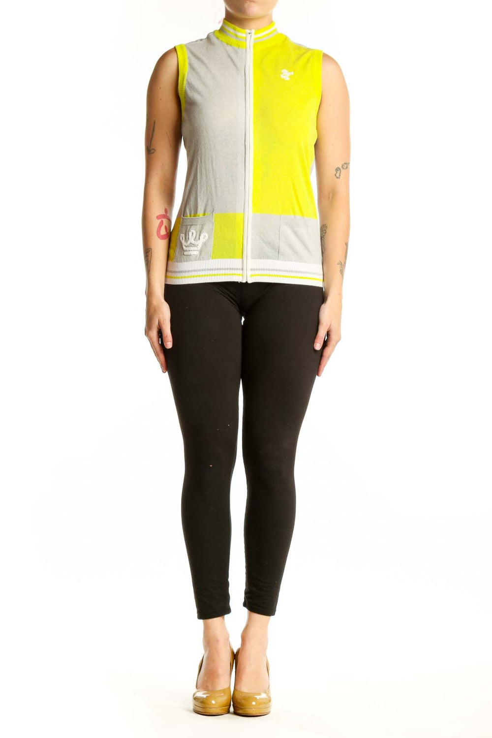 Yellow and cream color-block sleeveless vest with white full-length zipper and ribbed trim, front view