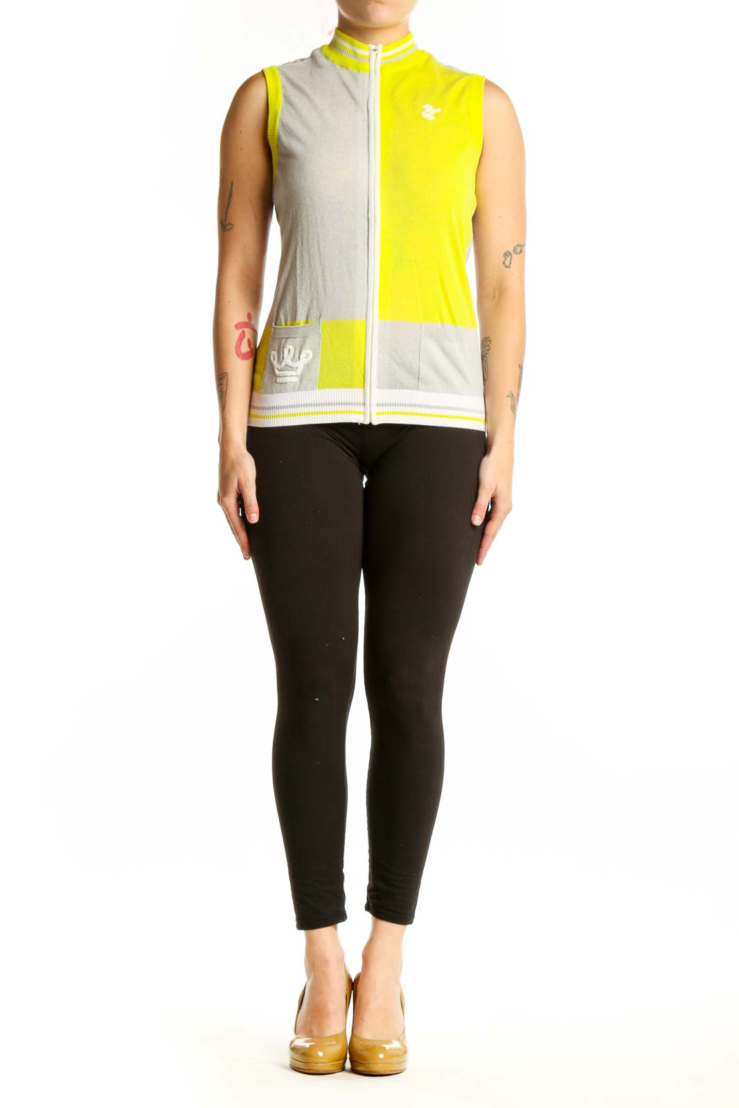 Yellow and cream color-block sleeveless vest with white full-length zipper and ribbed trim, front view