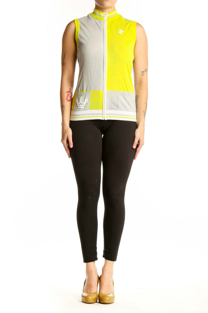 Yellow and cream color-block sleeveless vest with white full-length zipper and ribbed trim, front view