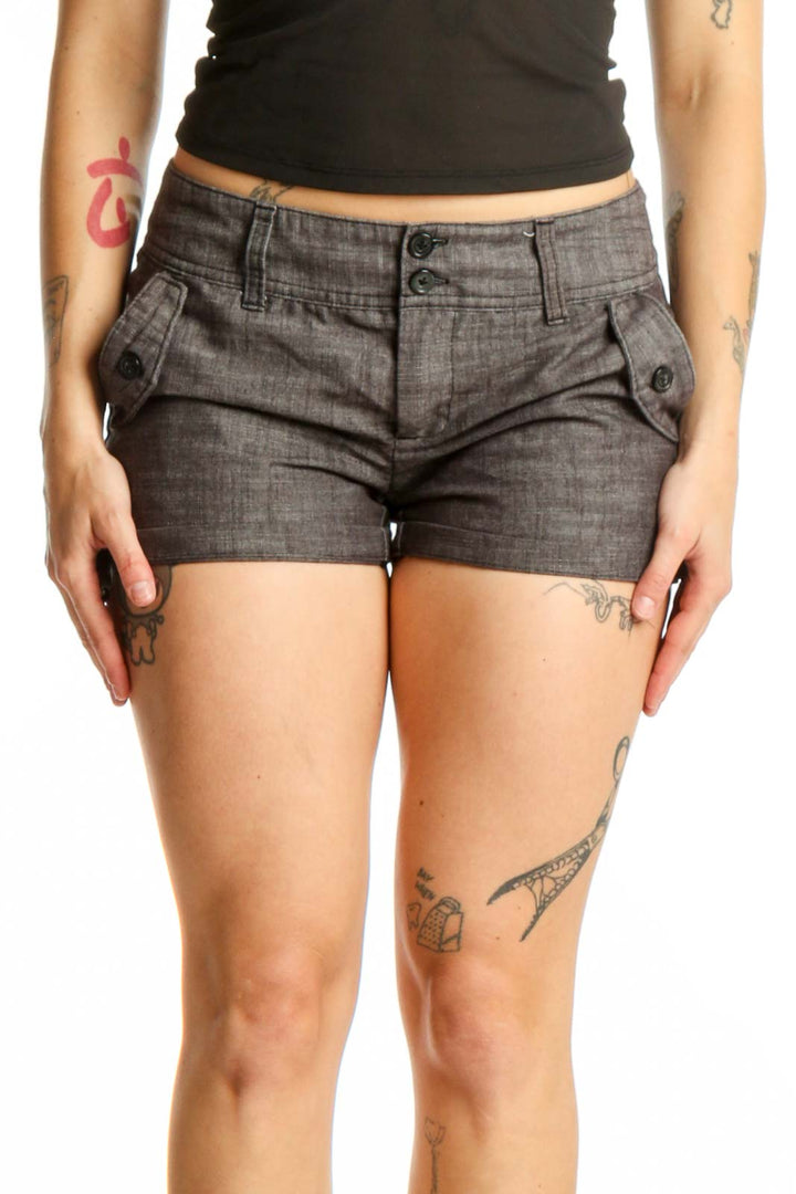 Gray denim shorts with flap pockets and classic five-pocket design, front view on model
