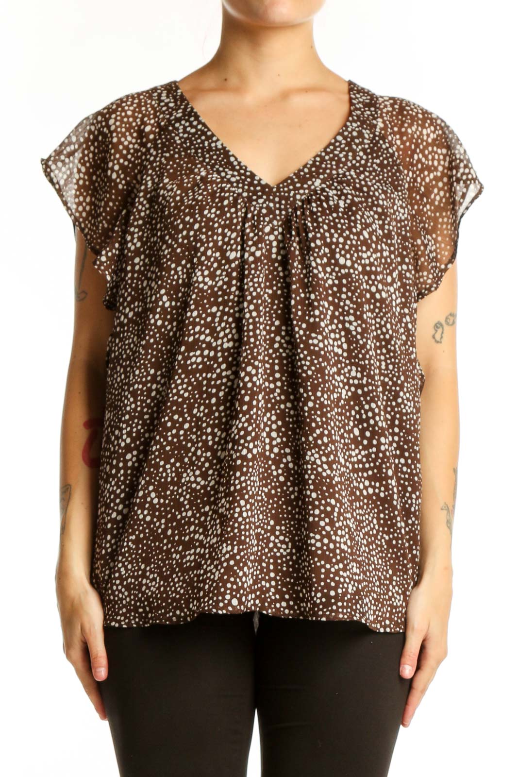 Brown polka dot LOFT top with V-neckline and cap sleeves, front view on model