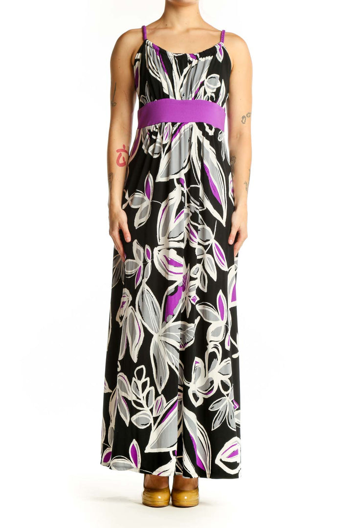 Black floral maxi dress with purple and white botanical print and purple waistband, front view
