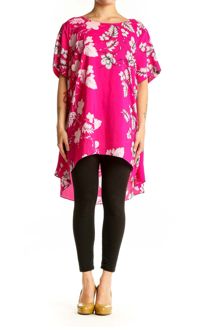 Pink floral hi-low blouse with white and mauve botanical print, short flutter sleeves, worn with black leggings