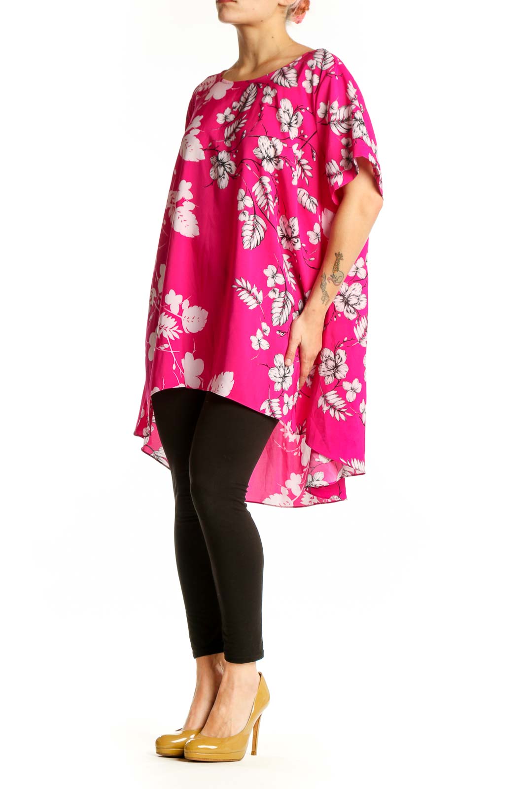 Pink floral hi-low blouse with white and mauve botanical print, short flutter sleeves, worn with black leggings