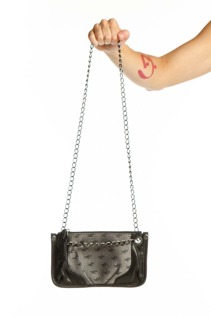 Black quilted shoulder bag with silver chain strap by Kenneth Cole New York, front view