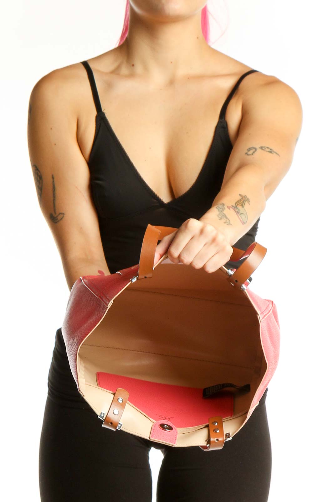 Back view of pink Lauren Ralph Lauren tote bag worn on shoulder, showing structured silhouette and design details