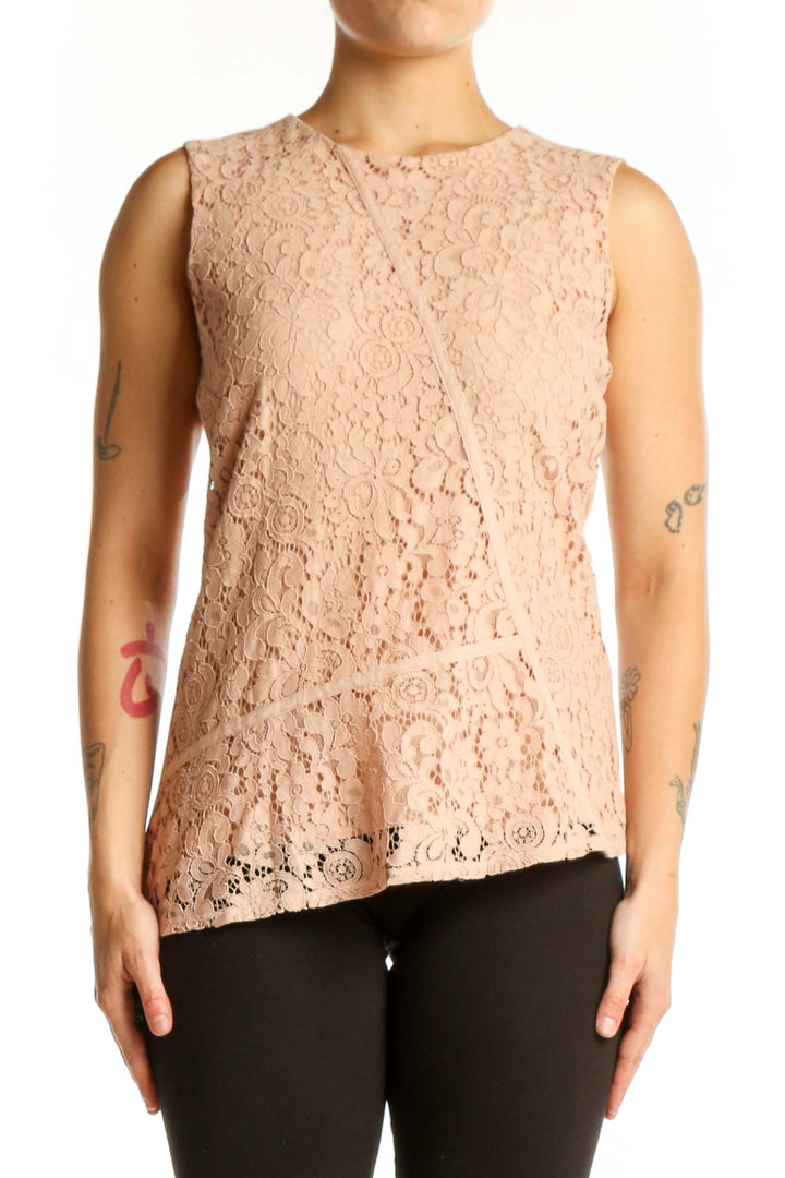 Beige lace sleeveless tank top with intricate floral pattern, front view on model