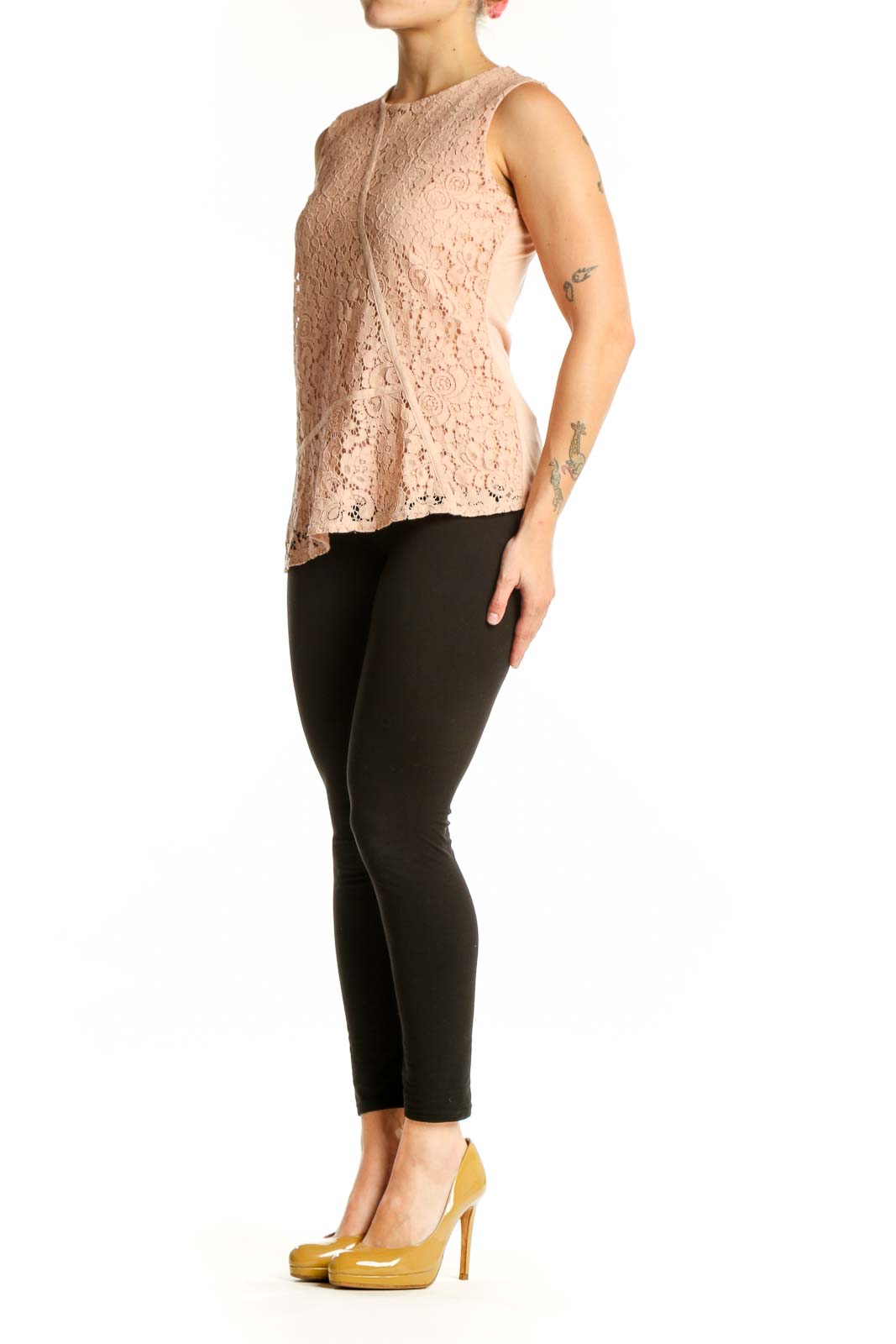 Beige lace sleeveless tank top with intricate floral pattern, front view on model