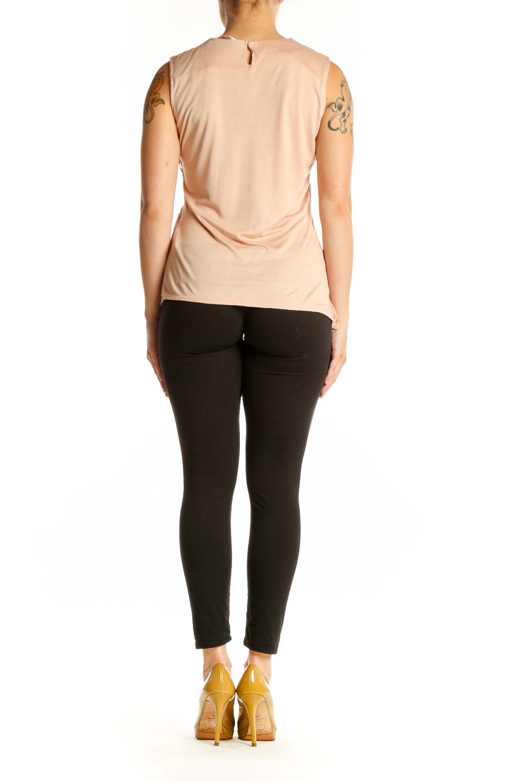 Beige lace sleeveless tank top with asymmetrical hem, back view on model wearing black pants