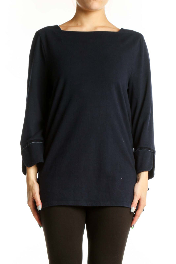 Navy cotton long sleeve top with boat neckline and rolled cuffs, front view on model