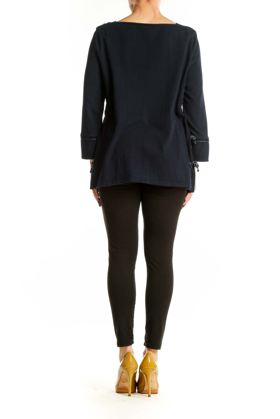 Navy cotton long sleeve top with rolled cuff details, back view on model