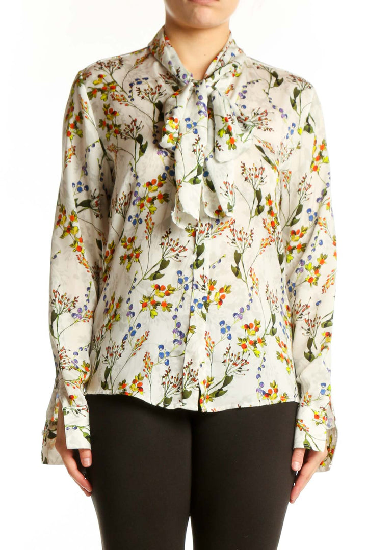 Cream floral button-up blouse with vibrant botanical print, long sleeves, and collared neckline