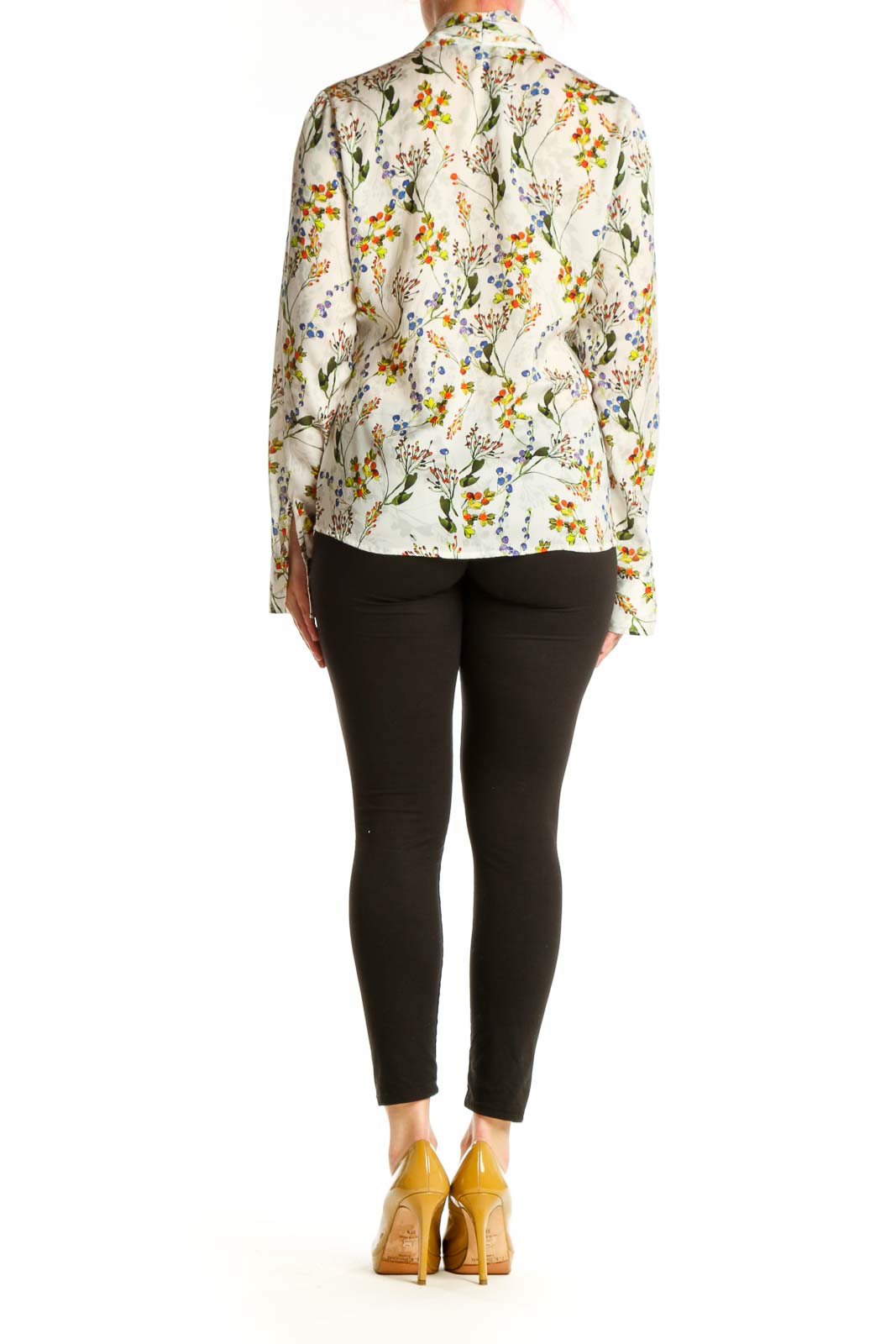 Back view of cream floral blouse showing full botanical print pattern and tailored fit