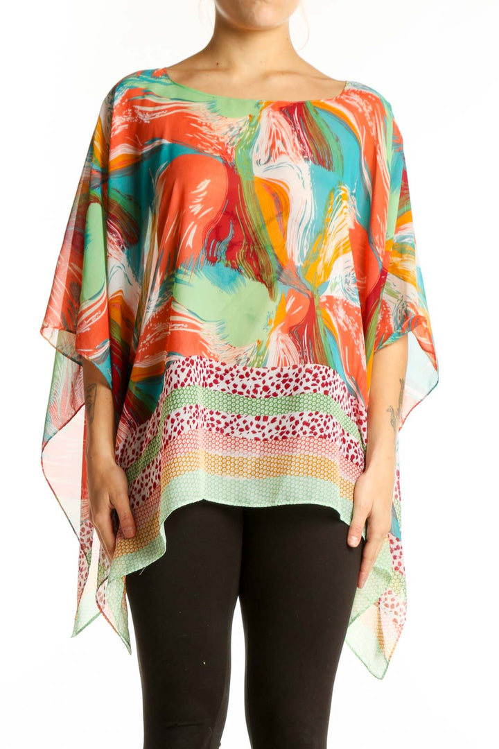 Multicolor abstract print poncho top with flowing asymmetrical hemline, featuring vibrant red, orange, green, blue and yellow brushstroke patterns