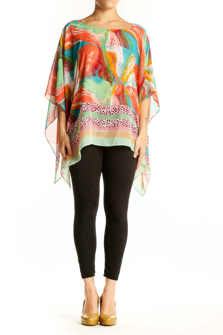 Multicolor abstract print poncho top with flowing asymmetrical hemline, featuring vibrant red, orange, green, blue and yellow brushstroke patterns