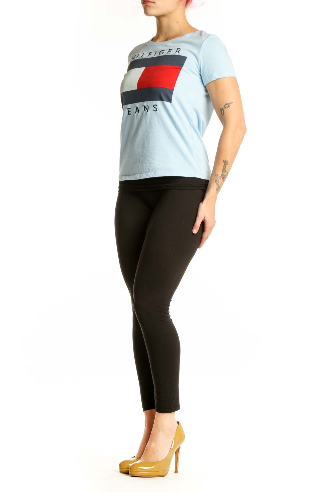 Light blue Hilfiger Jeans graphic t-shirt with colorblock logo design featuring red, navy, and cream stripes