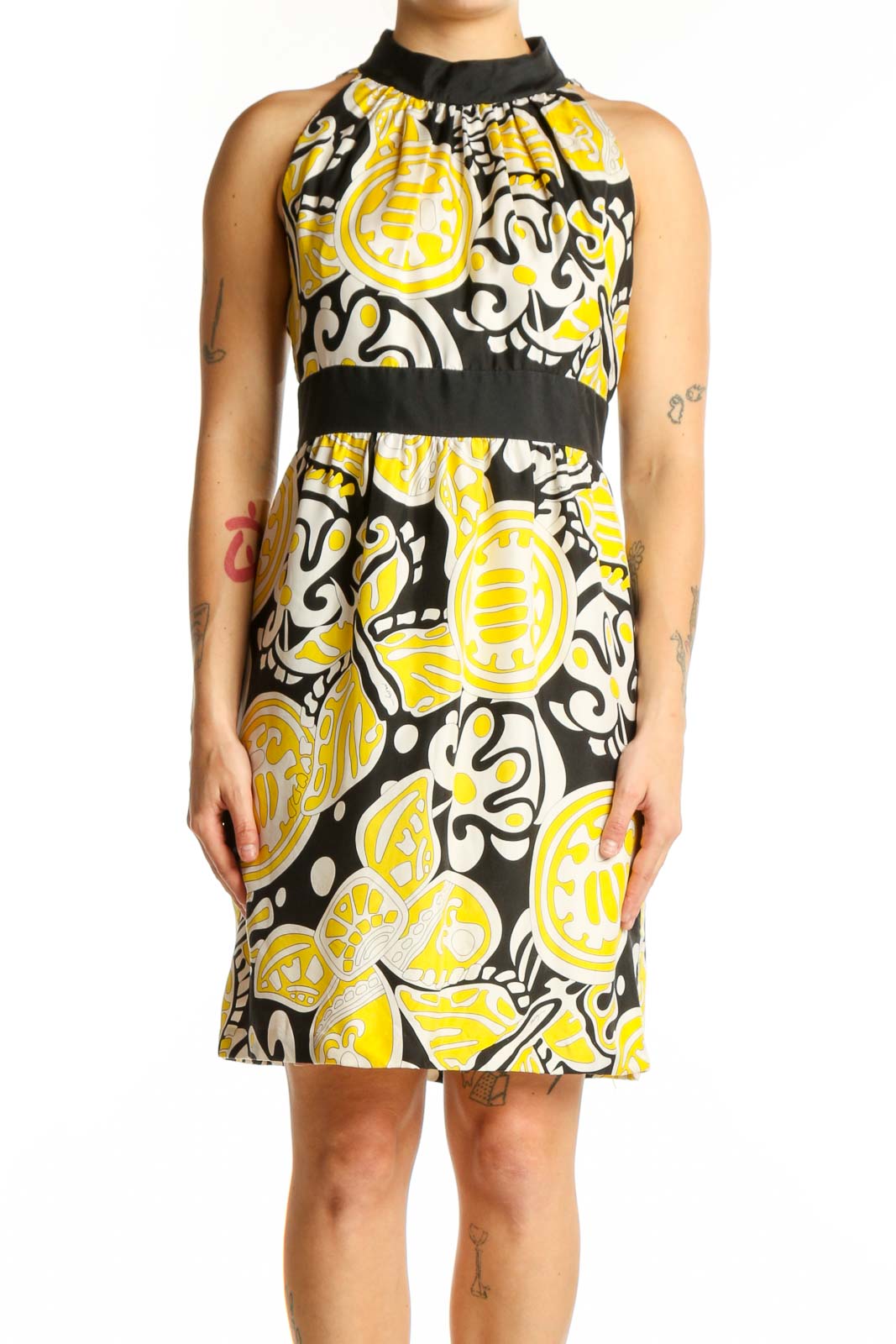Yellow and black abstract silk halter dress with color-blocked waistband, front view